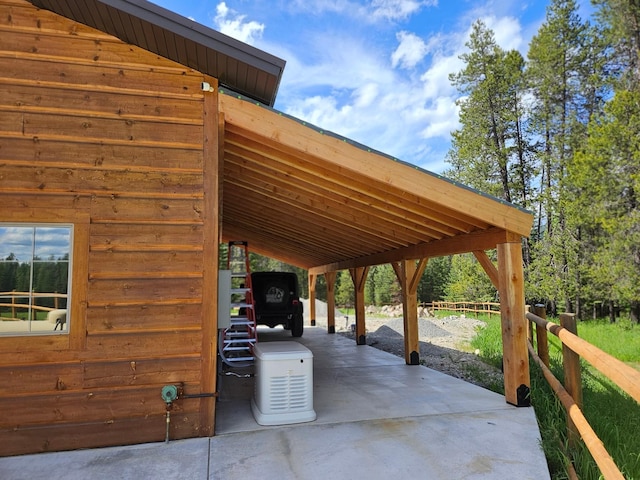 view of vehicle parking with a carport