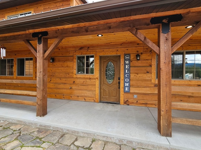 doorway to property featuring a porch