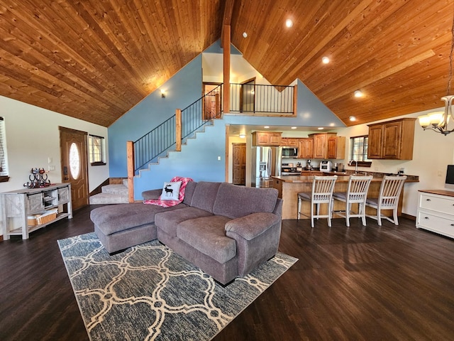 living room featuring dark hardwood / wood-style floors, wood ceiling, high vaulted ceiling, and a chandelier