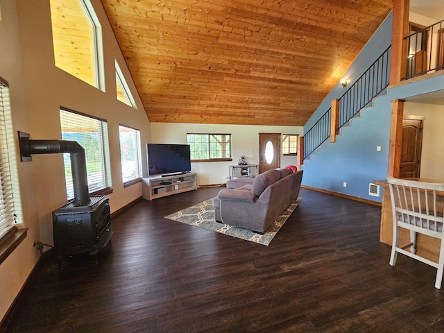 living room with a wood stove, dark hardwood / wood-style flooring, high vaulted ceiling, and wooden ceiling