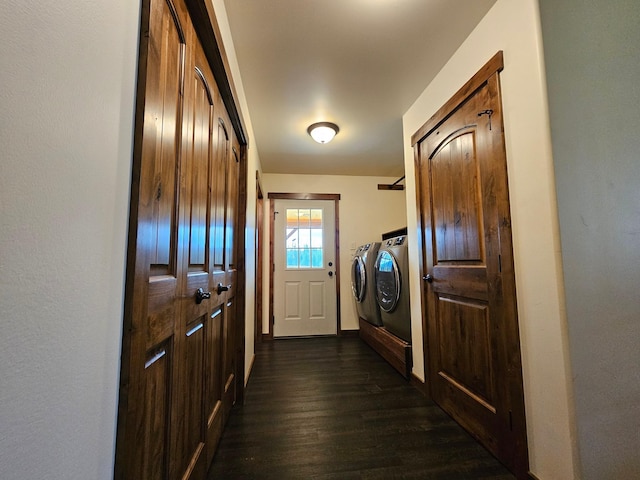 doorway with washing machine and clothes dryer and dark wood-type flooring