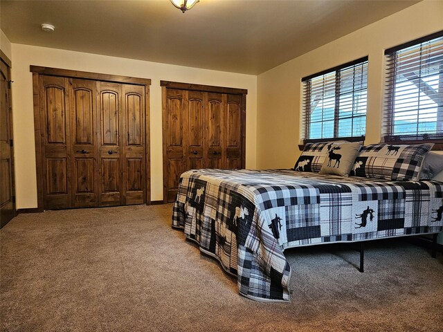 bedroom with dark carpet