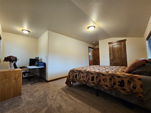 bedroom featuring carpet floors and lofted ceiling