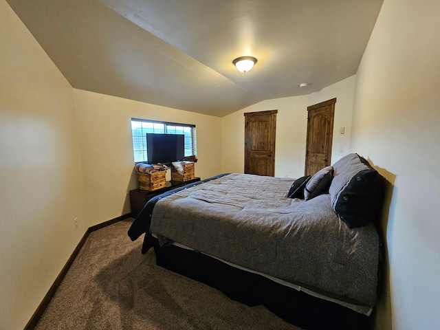 bedroom featuring carpet flooring and lofted ceiling