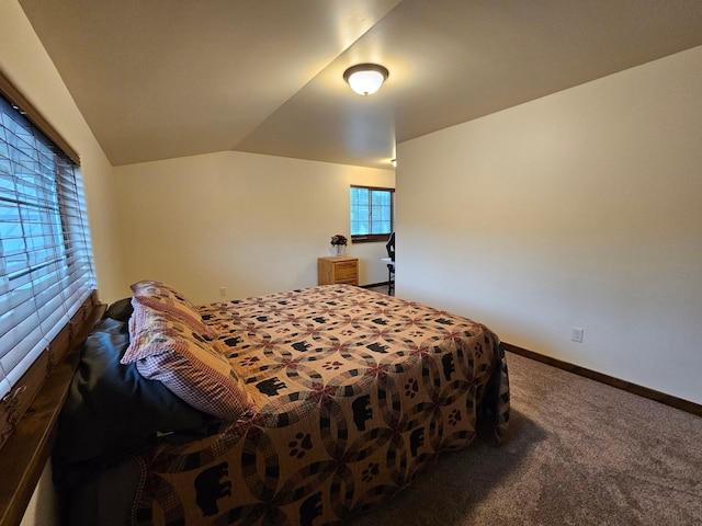 carpeted bedroom featuring vaulted ceiling