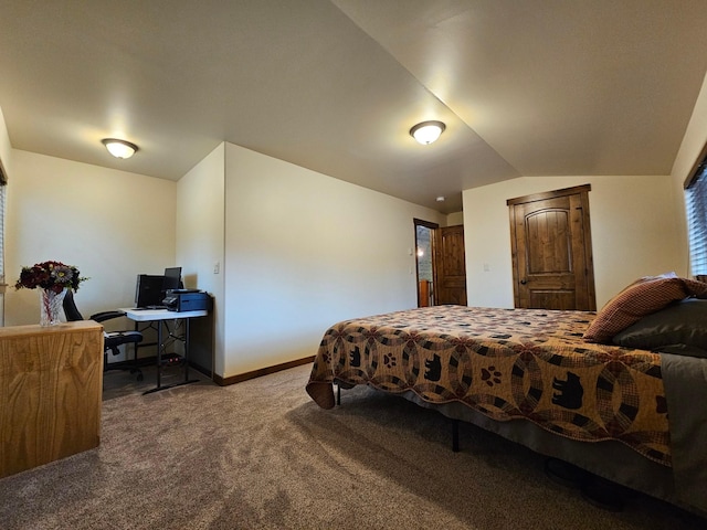 bedroom with carpet and lofted ceiling