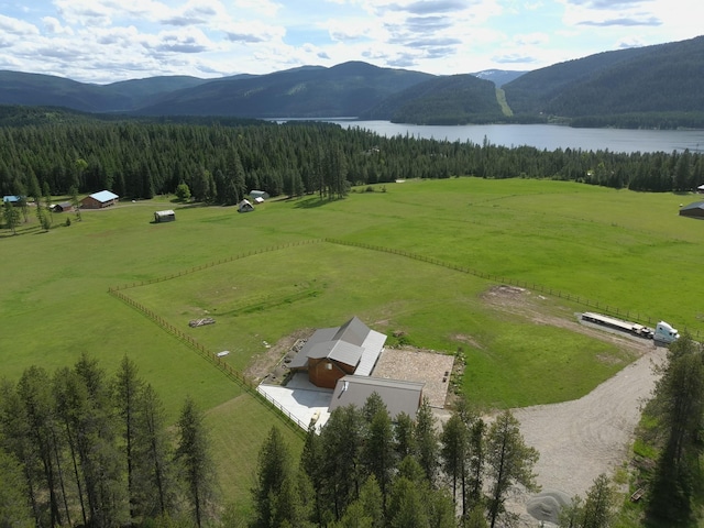 aerial view featuring a rural view and a water and mountain view