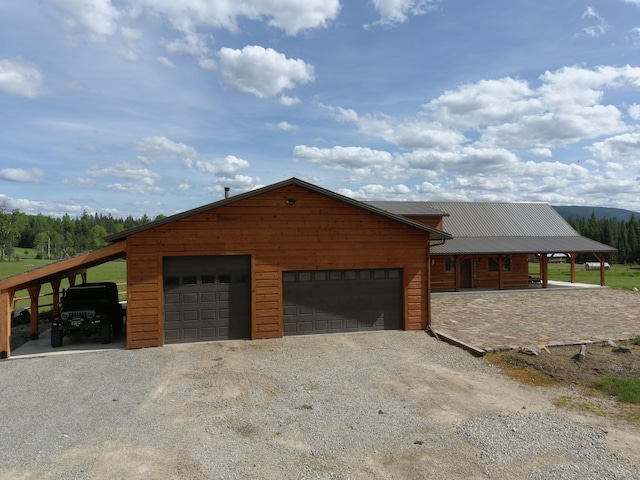 exterior space featuring a carport and a garage