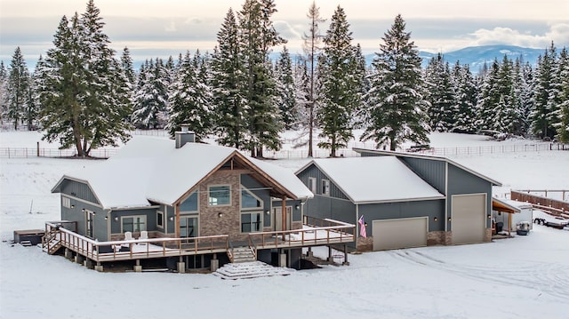 exterior space featuring a garage and a deck