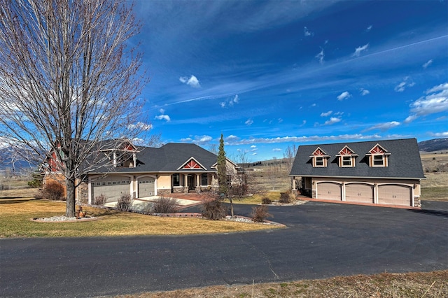 view of front facade with covered porch and a garage