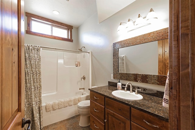 full bathroom with vanity, shower / tub combo, and toilet