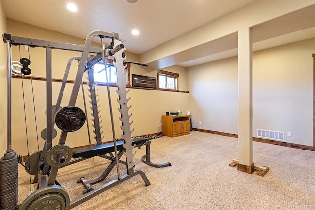 workout room with light colored carpet