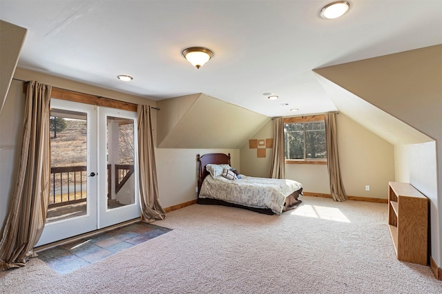 bedroom featuring access to exterior, french doors, carpet floors, and lofted ceiling