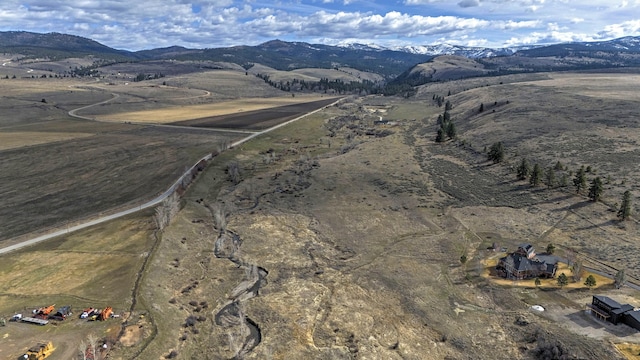 bird's eye view featuring a mountain view and a rural view