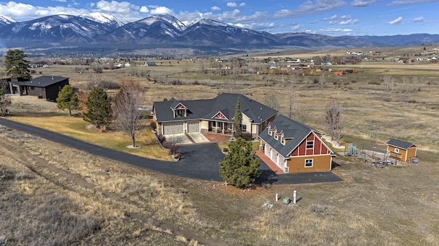 drone / aerial view featuring a mountain view and a rural view