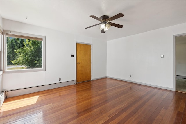 unfurnished room with a baseboard radiator, hardwood / wood-style flooring, and ceiling fan