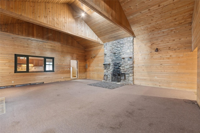 unfurnished living room featuring carpet flooring, a stone fireplace, wooden ceiling, and high vaulted ceiling