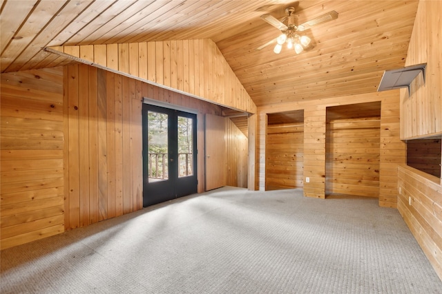 bonus room with carpet flooring, french doors, wooden walls, and wood ceiling