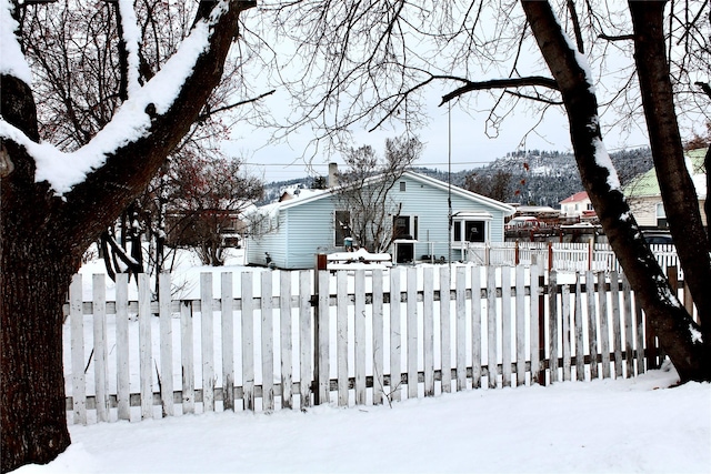 yard covered in snow featuring fence private yard