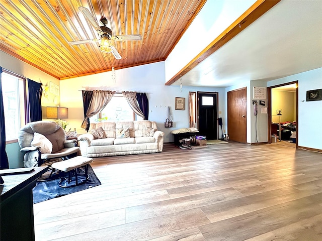 living room featuring light wood finished floors, wooden ceiling, ceiling fan, vaulted ceiling, and crown molding