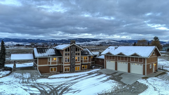 view of front of house featuring a mountain view and a garage