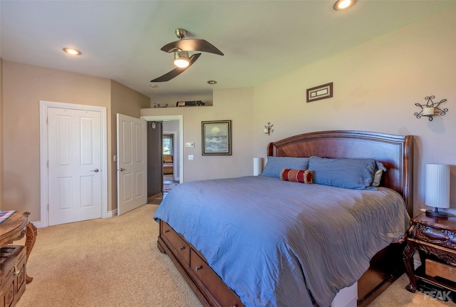 bedroom with light carpet and ceiling fan