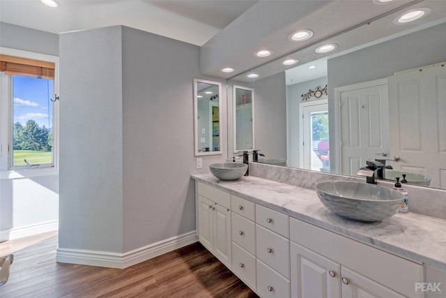 bathroom featuring hardwood / wood-style floors and vanity