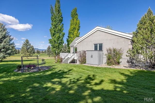 view of yard featuring a wooden deck