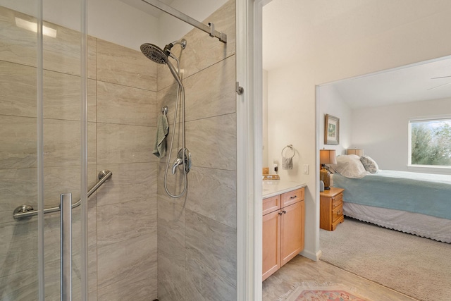 bathroom with an enclosed shower and vanity