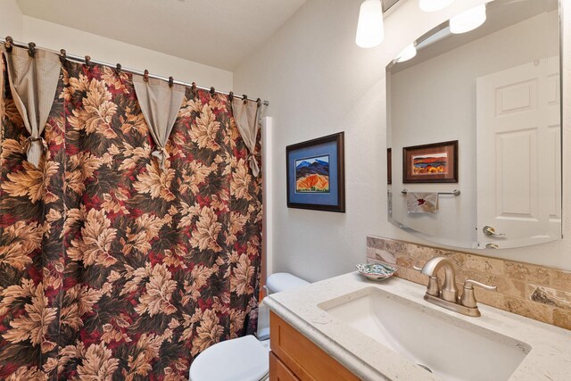 bedroom featuring light carpet and a textured ceiling