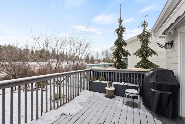 snow covered deck with grilling area