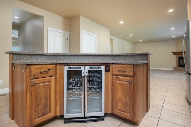 kitchen with light tile patterned floors and wine cooler