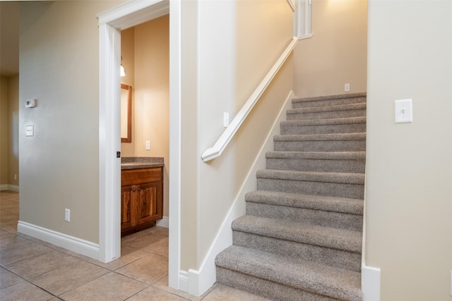 staircase with tile patterned floors