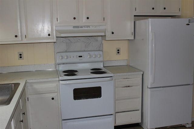 kitchen with white cabinetry, sink, and white appliances