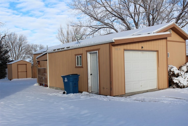 view of snow covered garage