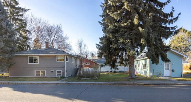 view of side of home with a lawn