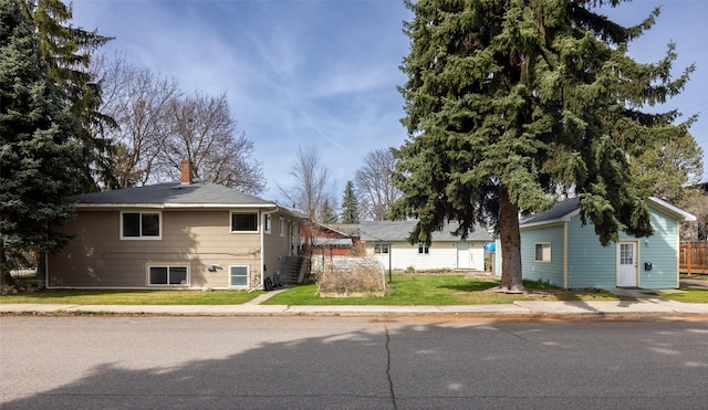200 N Ave W, Missoula, MT 59801 - view of front of home with a front yard and a chimney