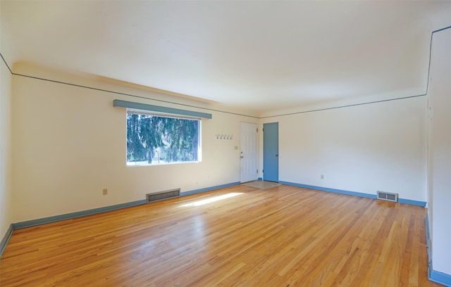 200 N Ave W, Missoula, MT 59801 - empty room featuring light wood finished floors, baseboards, and visible vents