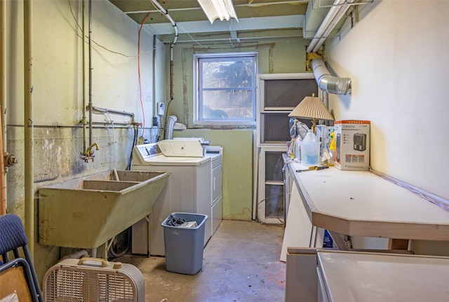 washroom featuring washing machine and clothes dryer and sink