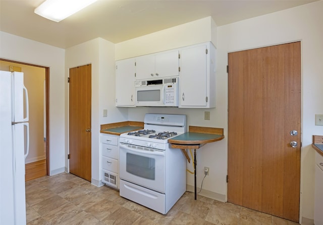 200 N Ave W, Missoula, MT 59801 - kitchen with baseboards, white cabinetry, and white appliances