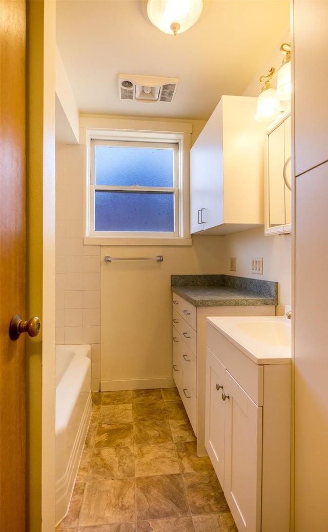 200 N Ave W, Missoula, MT 59801 - full bath featuring a tub to relax in, visible vents, and vanity