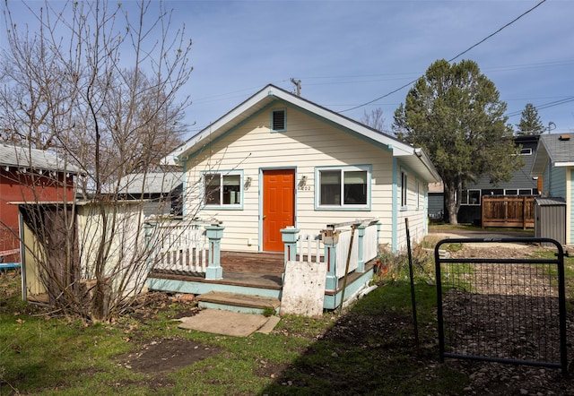 200 N Ave W, Missoula, MT 59801 - view of front of house with fence and a deck
