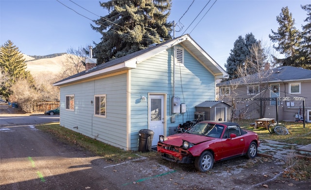 exterior space featuring a shed