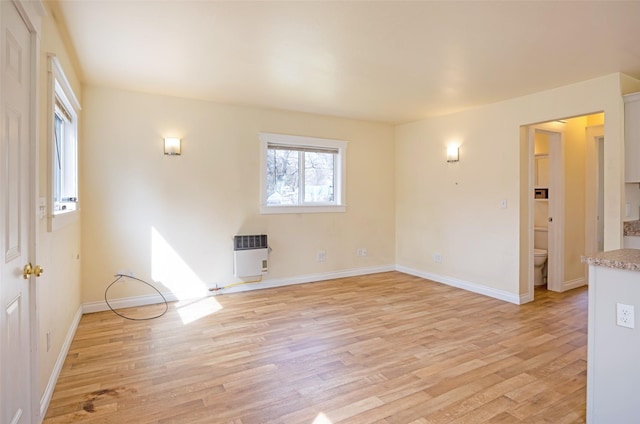200 N Ave W, Missoula, MT 59801 - unfurnished room featuring light wood-type flooring, baseboards, and heating unit