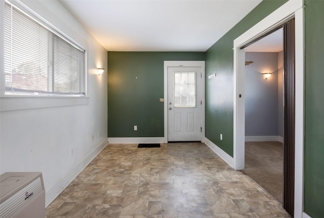200 N Ave W, Missoula, MT 59801 - entryway featuring baseboards and stone finish flooring