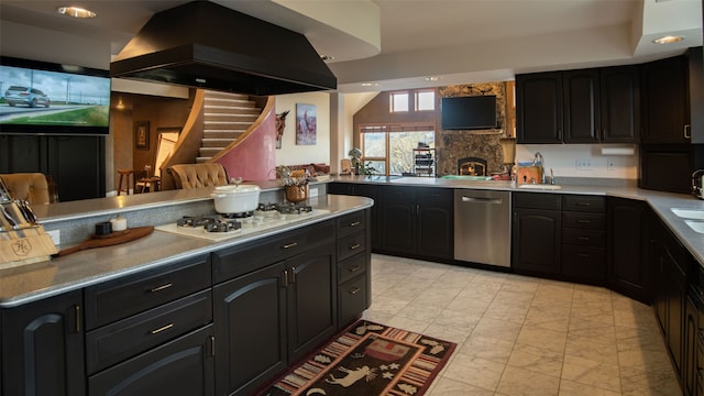 kitchen with white gas stovetop, sink, stainless steel dishwasher, kitchen peninsula, and island exhaust hood