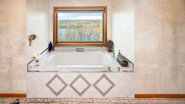 bathroom with tiled tub