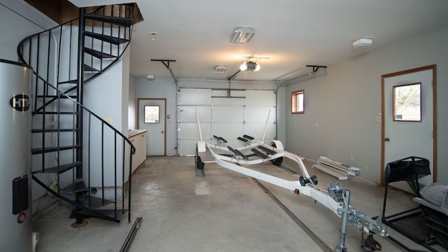 workout area featuring water heater and a healthy amount of sunlight