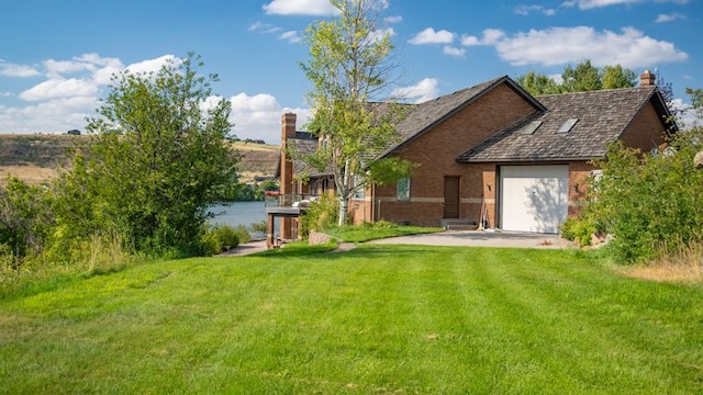 view of yard featuring a garage