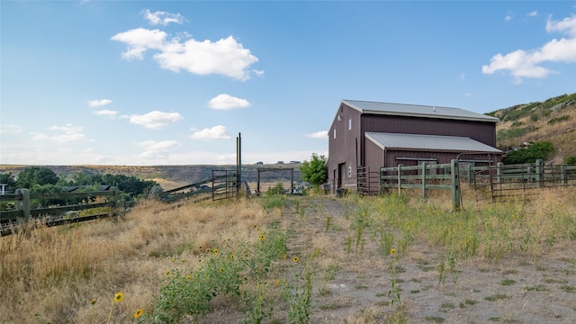 view of outdoor structure featuring a rural view